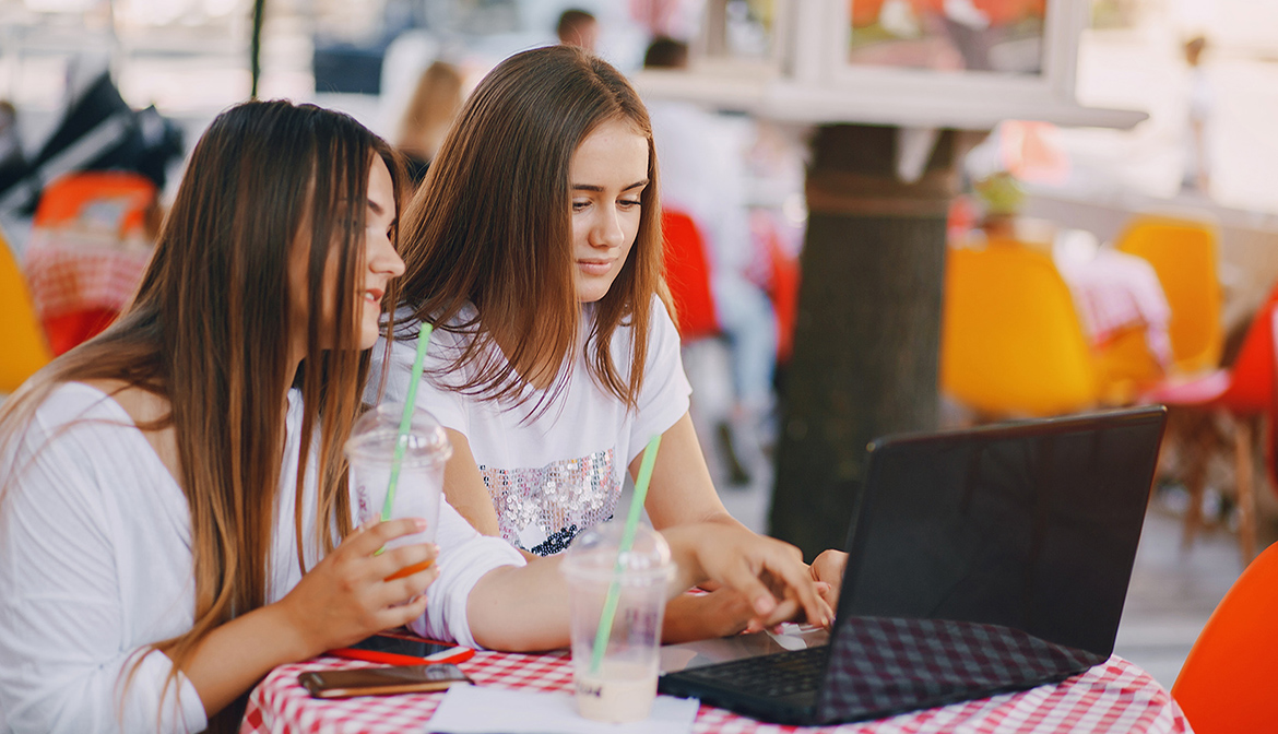 two girl with laptop